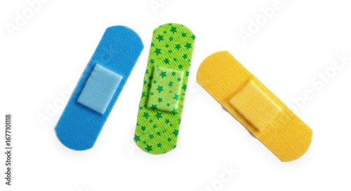 Three colorful adhesive bandages blue green with stars and yellow isolated on white