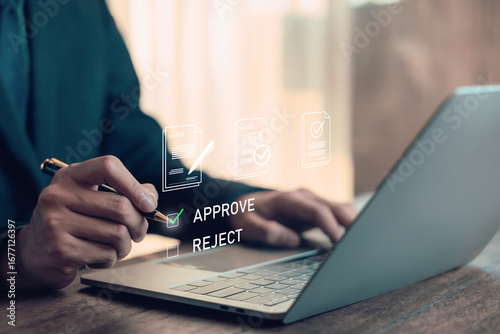 Businessman approving document on digital platform using laptop, concept for online contract, e-signature, workflow automation, and paperless office in modern business management. approving online