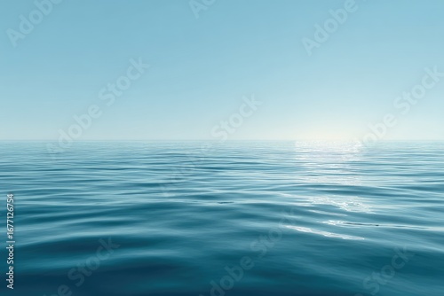 Calm, flat expanse of a tranquil blue sea meeting a pale blue sky