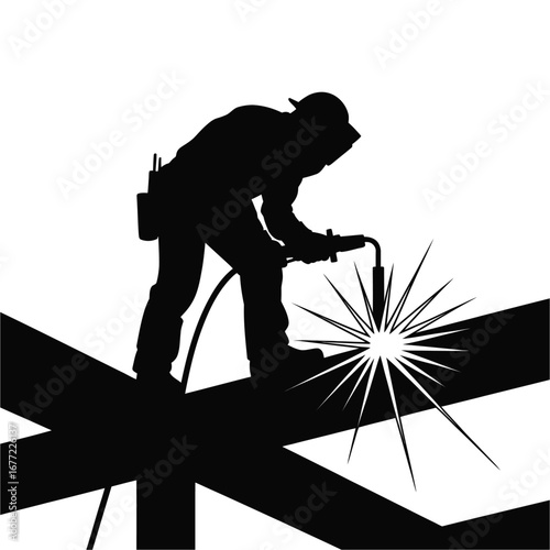 Silhouette of a welder working high up on construction beams