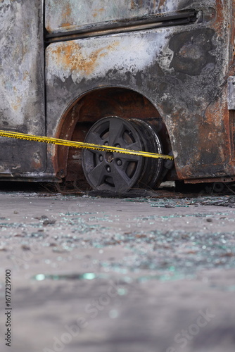 burned car with police line