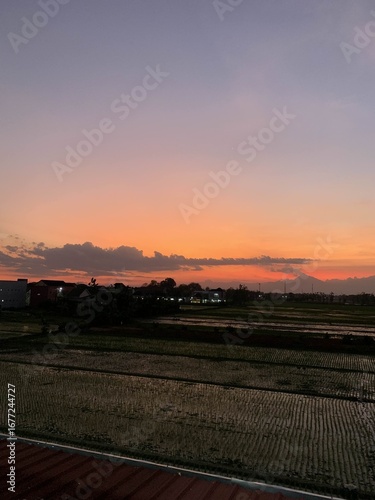 The colors of dusk dripped across the sky, as if the day was bidding farewell with tenderness.