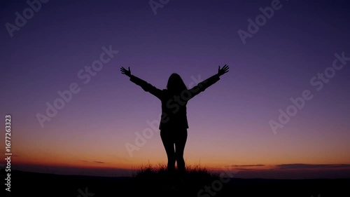 Wallpaper Mural The silhouette of youthful female figure with upper limbs elevated towards the heavens against the sky following solar descent. Torontodigital.ca