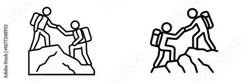 Two hikers helping each other climb a mountain