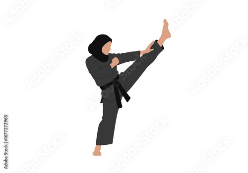 Powerful Woman in Hijab Executes a High Kick in Martial Arts.
