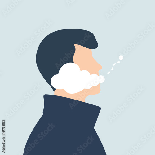 Person's profile with visible breath in the cold air