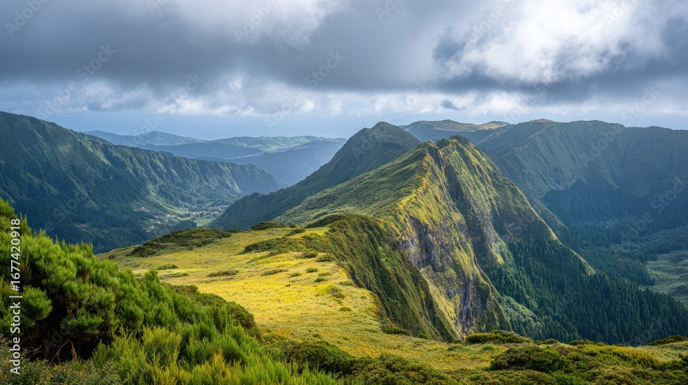 Fototapeta premium Majestic Mountain Ridge Panorama: A breathtaking panoramic view of rolling mountain ridges under a dramatic sky.