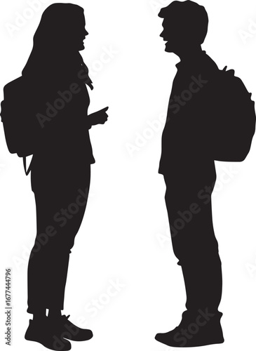 Two or more students standing together, chatting and laughing in the hallway or courtyard.