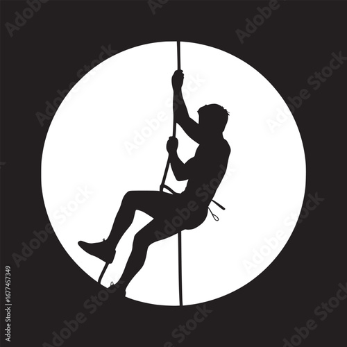 Silhouette of a man climbing a rope against a white circle on a black background in a studio shot