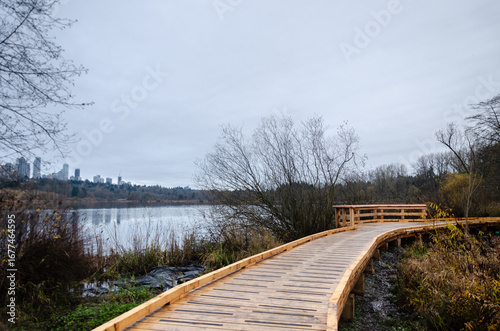 Elevated wooden walkay in Burnaby Deer Lake Park, BC, Canada