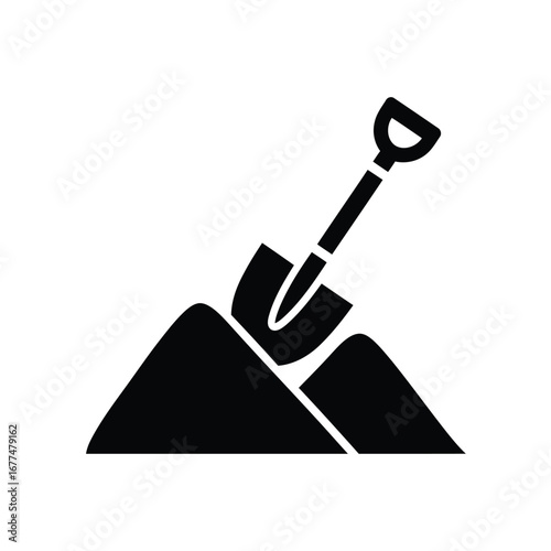Black silhouette of a shovel digging into a pile of earth or sand, representing work, construction, or gardening.