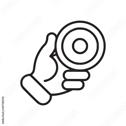 A hand holding a round object with concentric circles in a simple black and white line drawing style