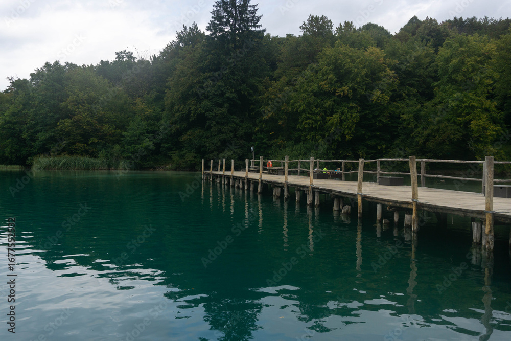 Fototapeta premium Wooden dock on the lake for ferry boat passengers at the Plitvice Lakes National Park (Plitvička Jezera, Croatia)