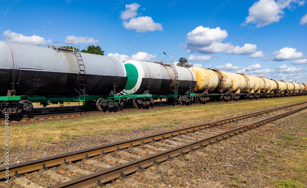 Naklejka premium Railway tank cars used to transport petroleum products. . Identification markings have been removed. The fuel train with petrochemical tank cars.