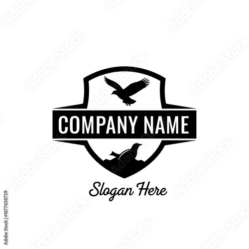 Black and white logo design with shield and birds.