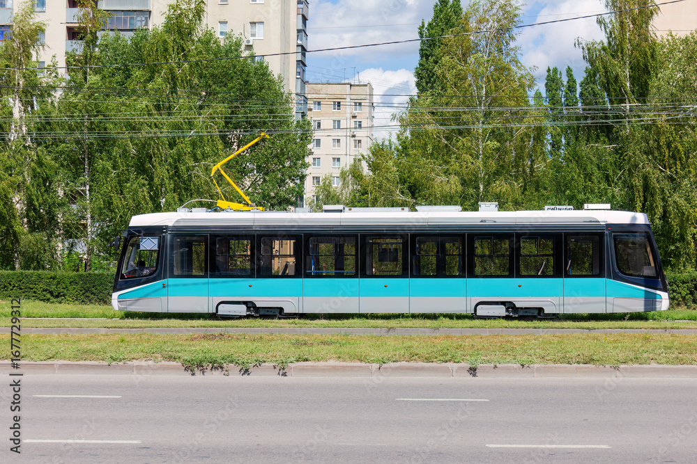 Obraz premium Modern Tram in Urban Environment