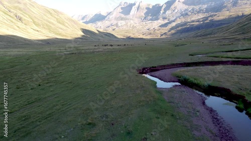 aerial drone view of sinuous river in the pyrenees mountains 