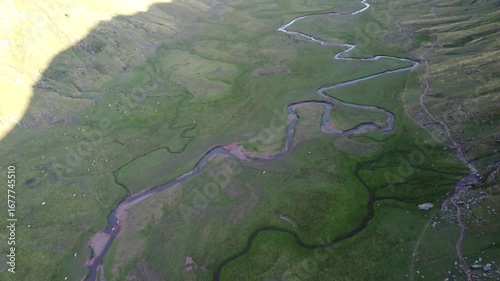 aerial drone view of sinuous river in the pyrenees mountains 