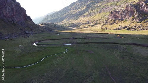 aerial drone view of sinuous river in the pyrenees mountains 