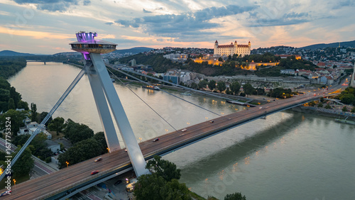 Photography Sunset view of SNP bridge and panorama of Bratislava, Slovakia