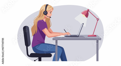 Remote work setup featuring young woman working on laptop with headphones on table in home office. Remote work includes laptop on desk with desk lamp.