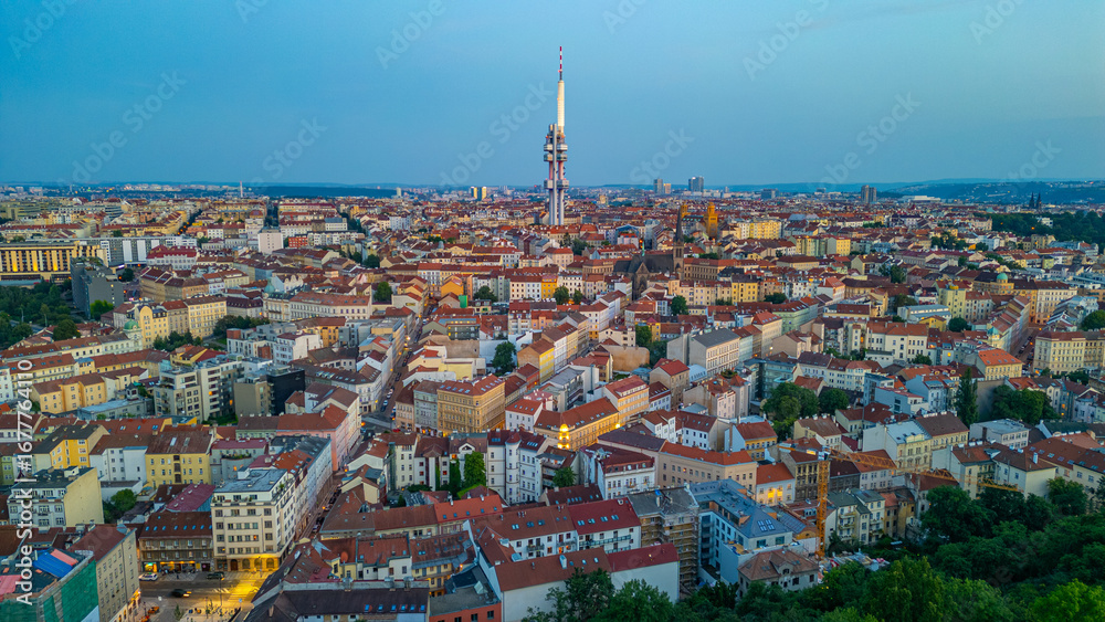 Fototapeta premium Sunset view of Zizkov TV tower overlooking Prague, Czech republi