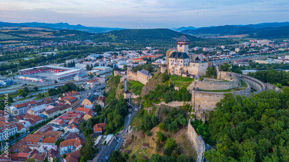 Fototapeta premium Sunset with Trencin castle overlooking the old town, Slovakia