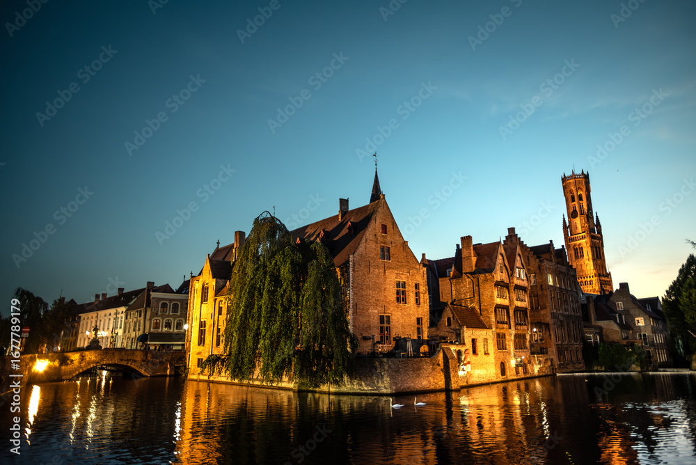 Fototapeta premium Rozenhoedkaai and Belfry of Bruges under a Twilight Sky - Bruges, Belgium
