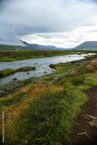 A River Runs Though A Valley On Cloudy Day
