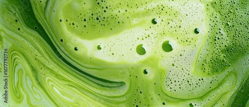frothy matcha latte with its signature vibrant green color and delicate swirling foam patterns, a macro and full-frame texture shot, close-up texture, top view
