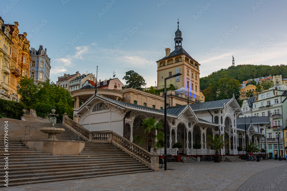Fototapeta premium Sunset view of castle tower and market colonnade in Karlovy Vary