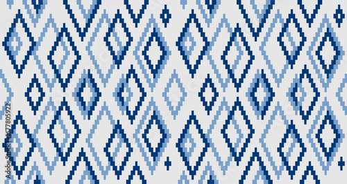 Geometric rhombus shapes vector seamless pattern. Repetitive design with a blue and gray color scheme creates a textile, fabric, or wallpaper background.