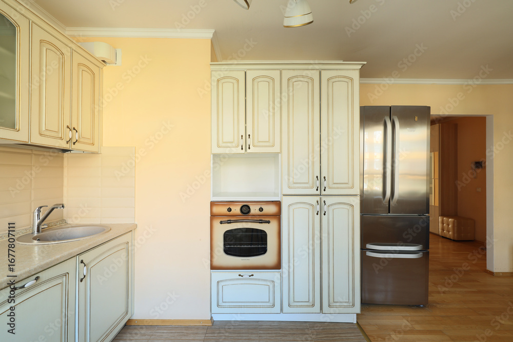 Fototapeta premium This stylish modern kitchen features classic design touches and highquality appliances