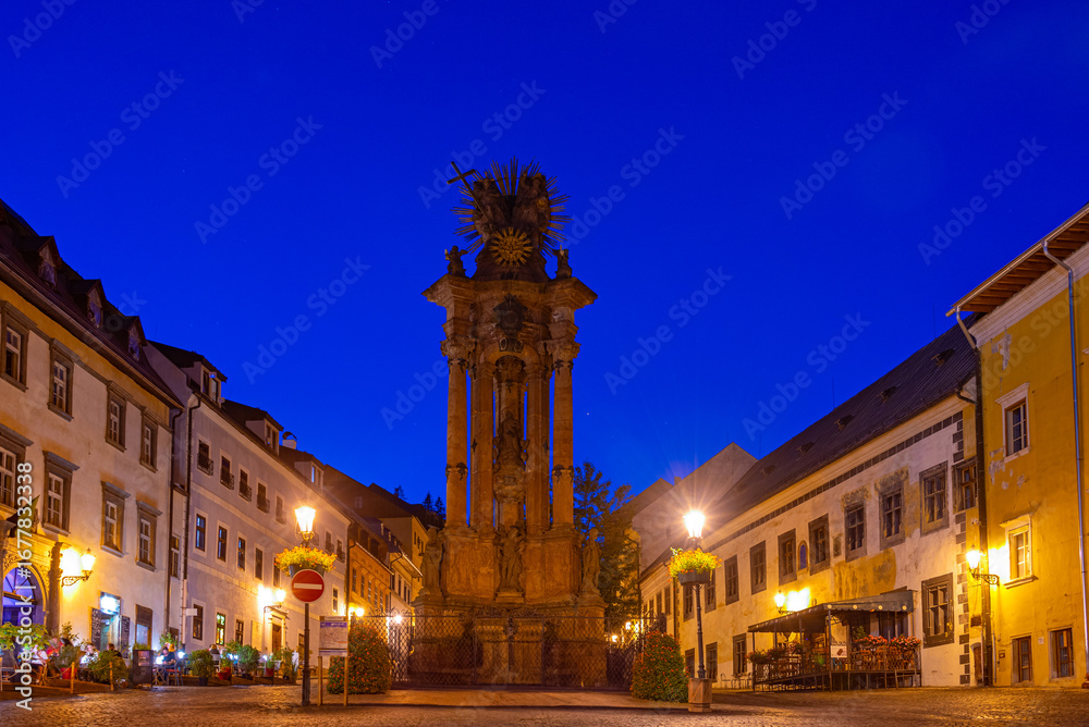Fototapeta premium Night view of the holy trinity square in Banska Stiavnica, Slova