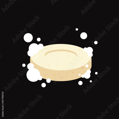 Round beige soap bar with a concave top and white bubbles surrounding it