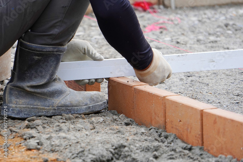 Brick Exterior Construction Work（レンガを使った外構工事の作業風景）