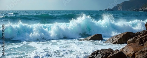 Powerful ocean waves crashing on a rocky shore, creating whitewater and sea foam Dramatic coastal scene with dynamic water movement and textured rocks , turquoise, force, natural beauty