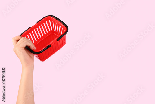 Woman holding mini shopping...