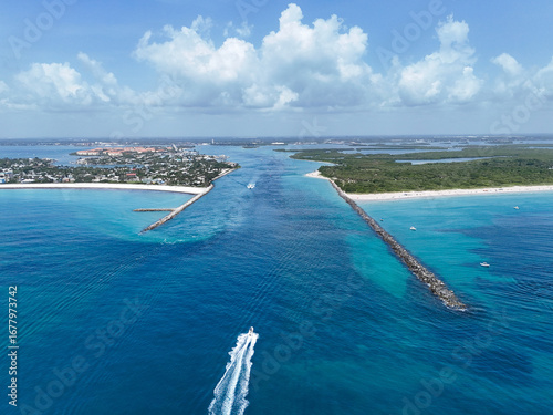 Slika na platnu Aerial view of a boat at the entrance to Fort Pierce Inlet on the Treasure Coast of Florida in St