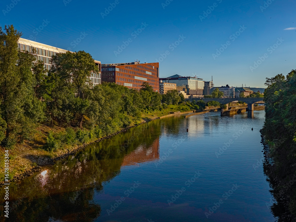 Fototapeta premium Karlin district reflected on Vltava river in Prague, Czech repub