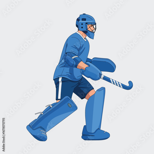 A field hockey goalie in full blue protective gear, holding a stick, ready to defend the goal.