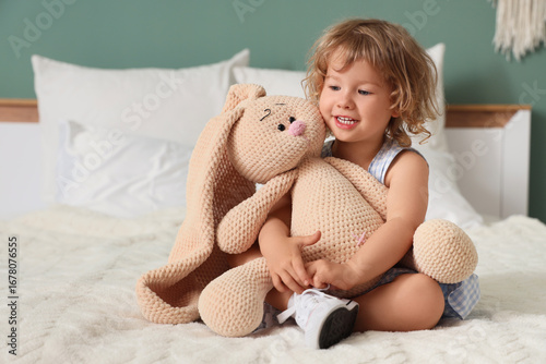 Cute little girl with toy b...