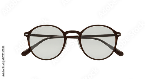 A close up shot of a pair of brown framed glasses with clear lenses on a black background studio shot