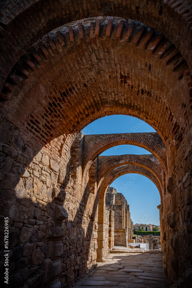 Fototapeta premium Excavations of the roman Casa del Mitreo in Merida, Spain,Stone columns of a Roman construction in Merida, Badajoz, Spain