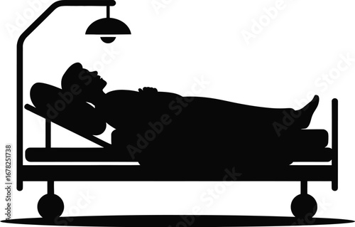 Patient lying in hospital bed with overhead lamp medical