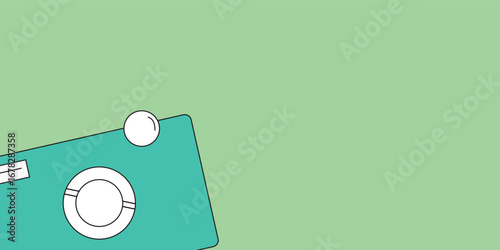 Minimal flat lay of a coffee cup on a teal table against a green background.