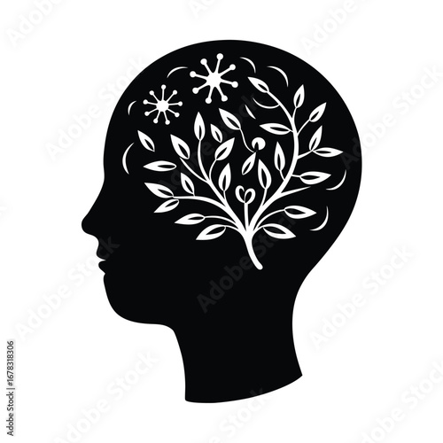 Silhouette of a human head with a tree growing inside