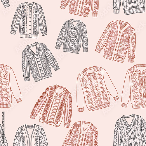 Cozy knitted cardigans and sweaters with intricate patterns displayed artistically on a soft pink background for fashion apparel design
