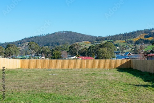 Vacant land lot in a new Australian suburb ready for new housing development.