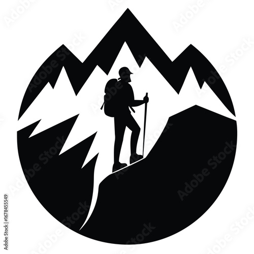 A hiker on a mountain peak